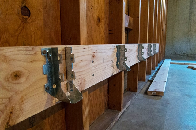 Joist hanger for timber connector